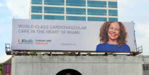 UHealth -World Class Cardiovascular Banner. Shows a women smiling.